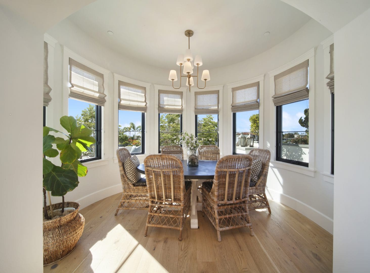 Round table with six chairs and a hanging light