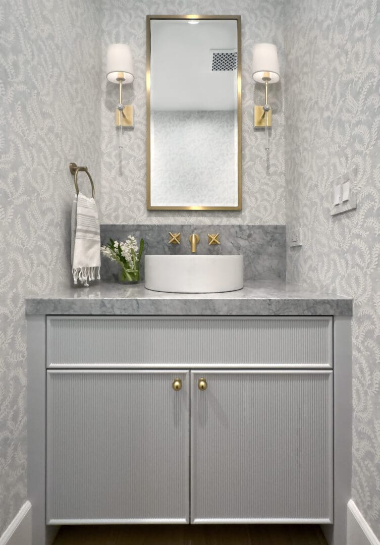 Gray color cabinets with mirror and wash basin