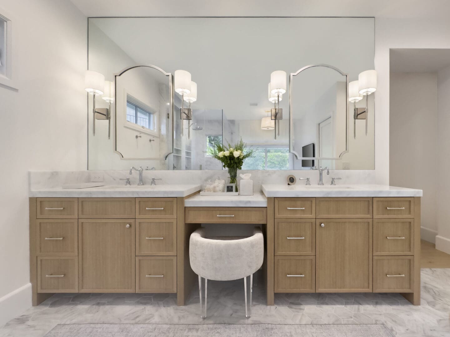 A bathroom with two sinks and a mirror.