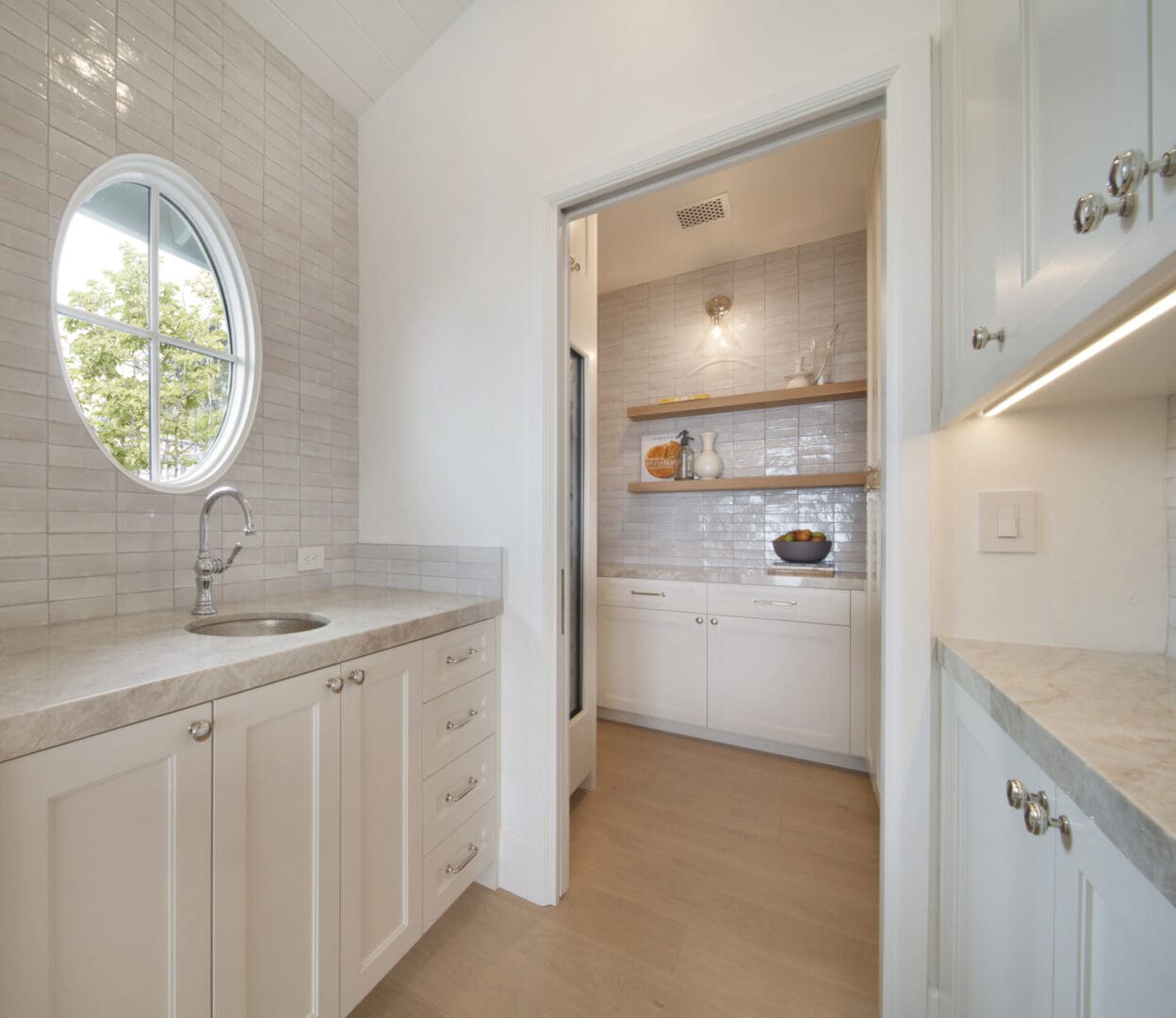 View of the kitchen with beige color cabinets