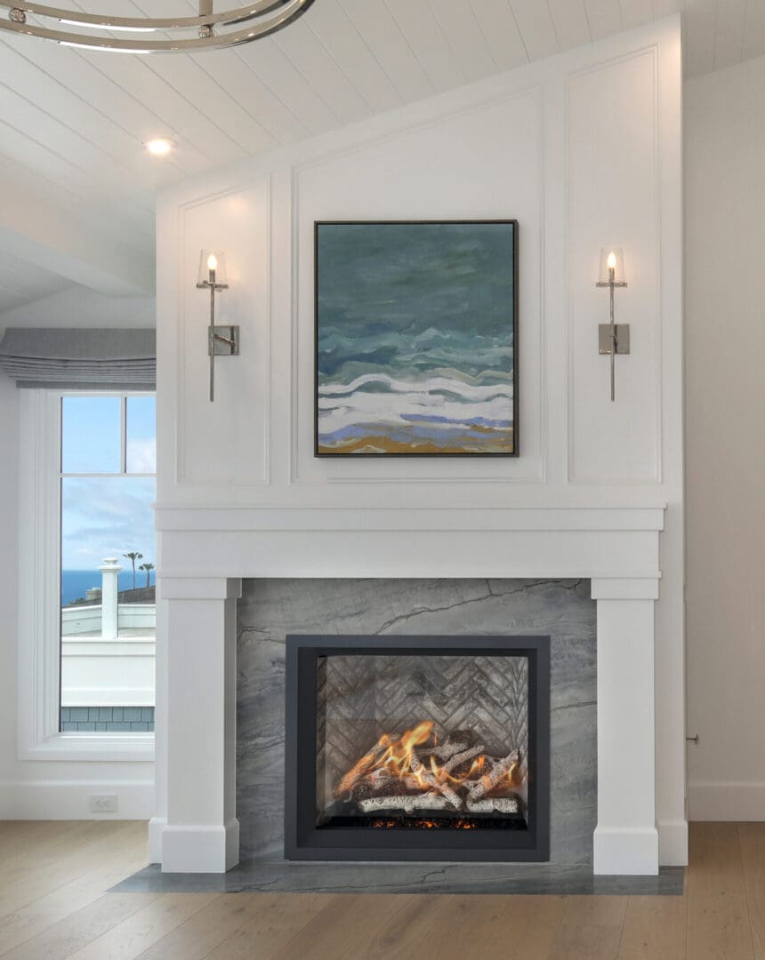 A living room with a fireplace and a painting on the wall.