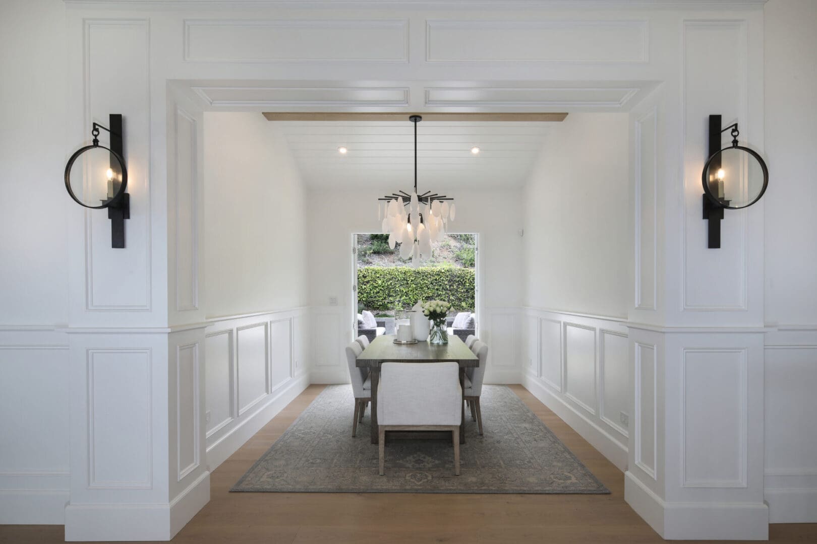 Closeup shot of white color sofas with hanging ceiling light