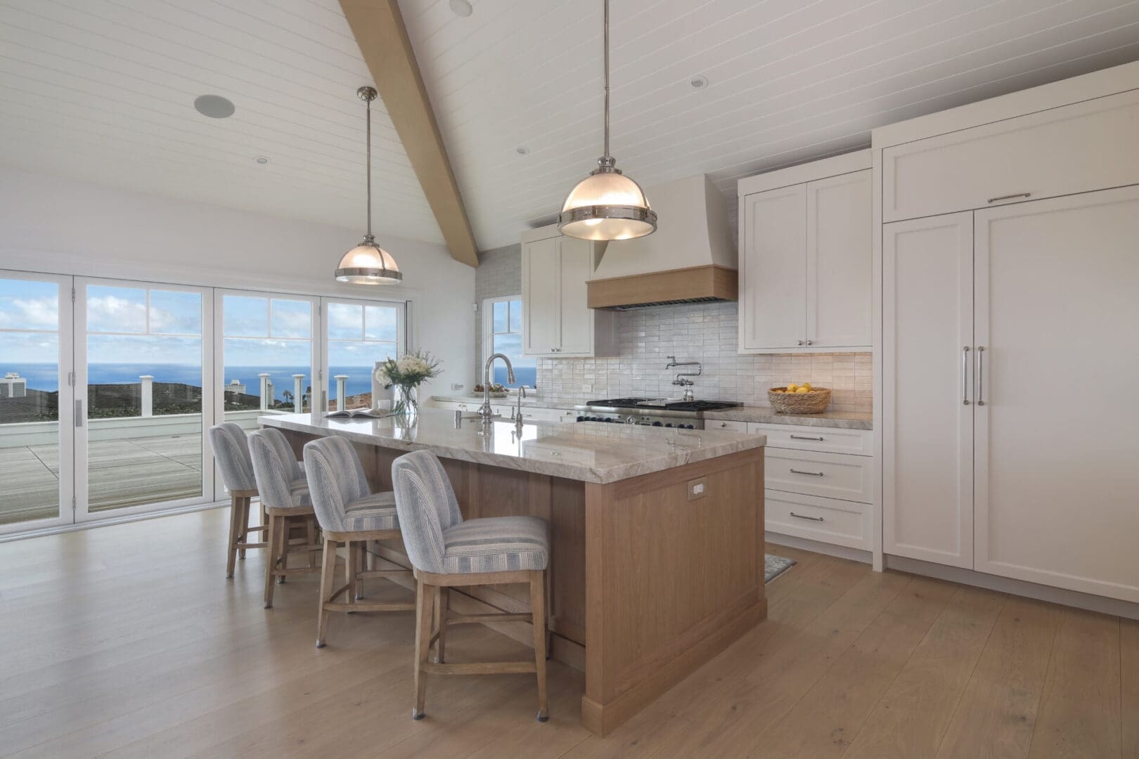 Long shot of the kitchen with white cabinets